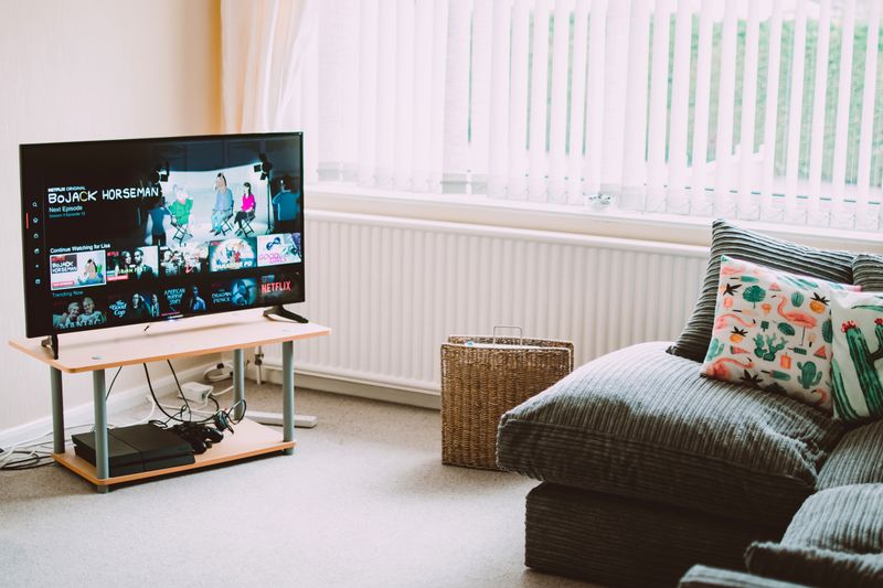 Smart TV working perfectly after a repair, streaming in a living room